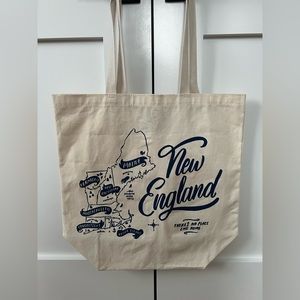 New England tote bag. Cream with navy blue writing. Never been used.